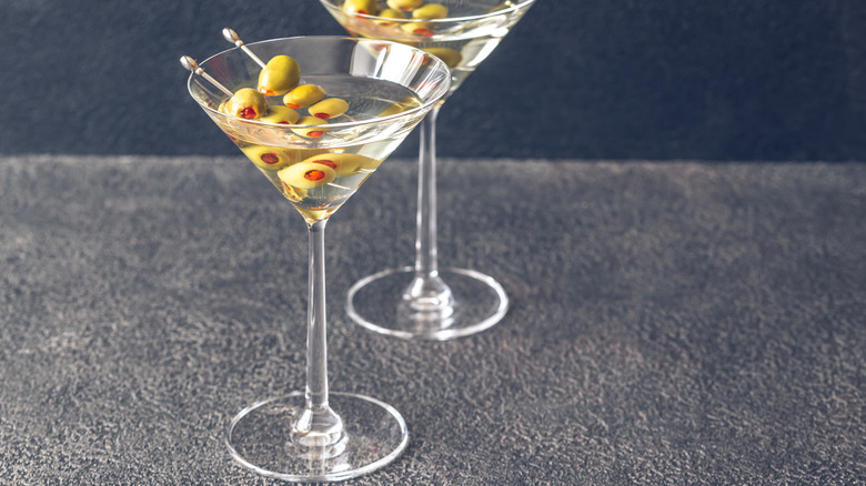 Two martinis with olive garnish