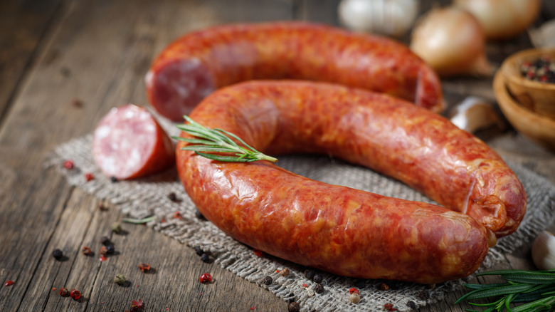 Smoked sausage on a wooden table