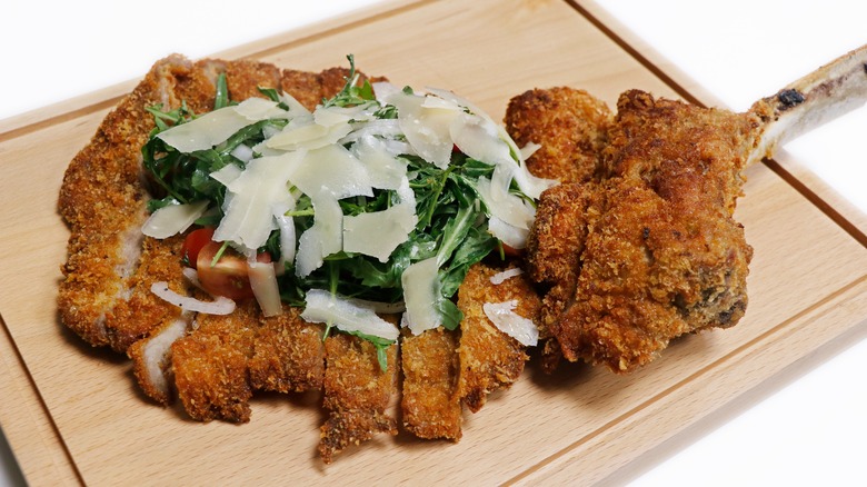 veal milanese on cutting board