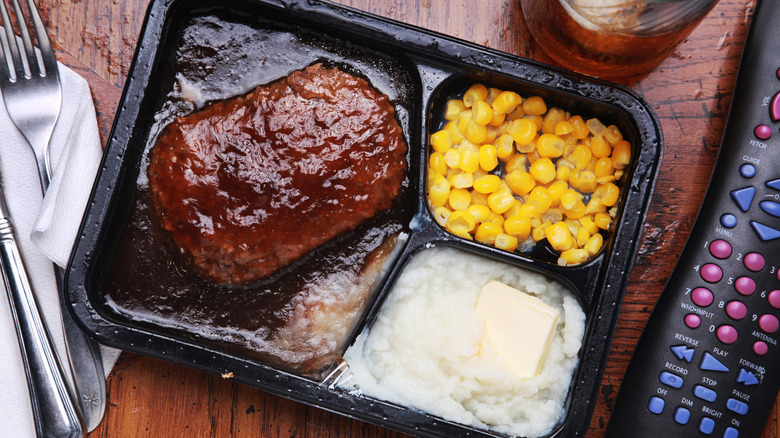 tv dinner on tray with remote