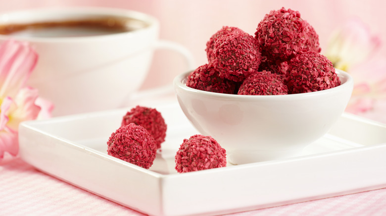 Bowl of raspberry-coated truffles