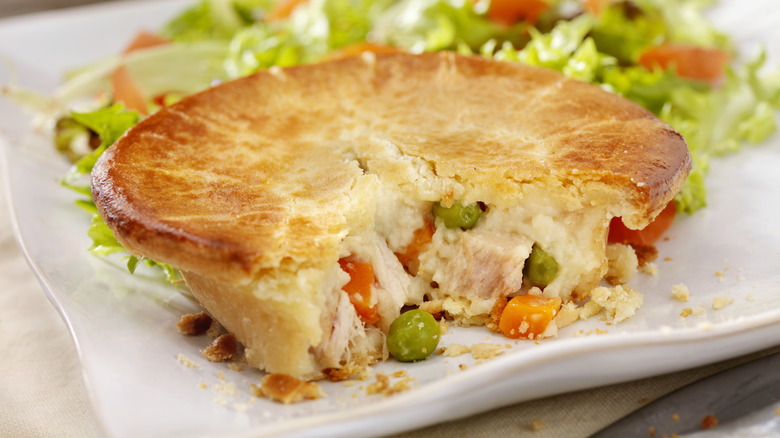 Sliced chicken pot pie with side salad