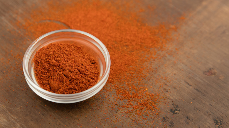 Powdered cayenne pepper in glass bowl