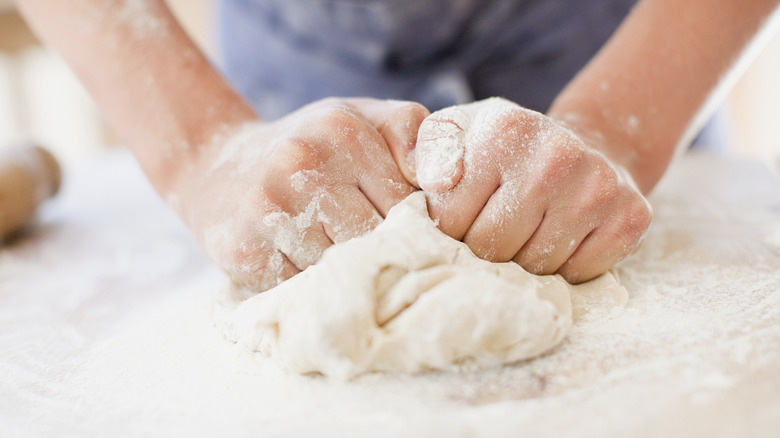 Dough being hand-kneaded close-up