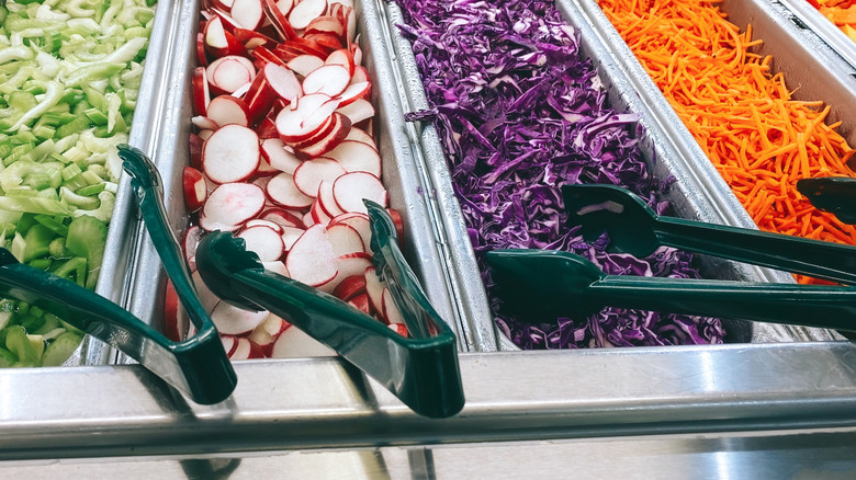 Serving tongs with vegetables