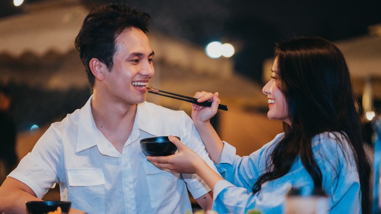 young couple sharing food