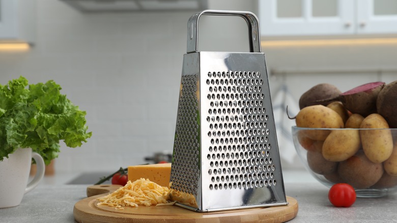 cheese grater with grated cheese