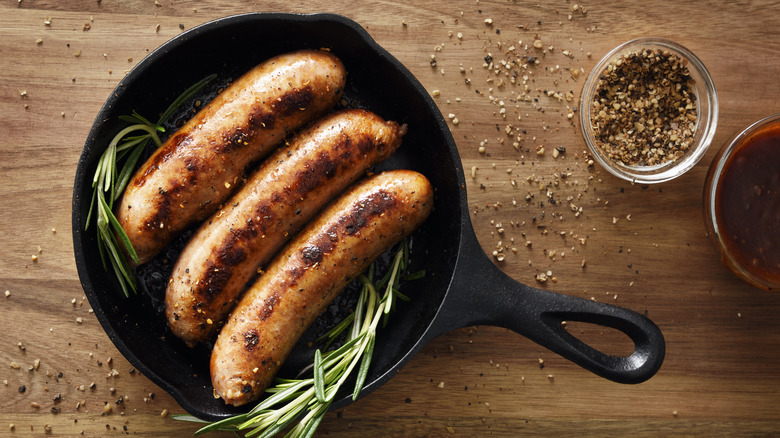 cooked sausages in cast iron