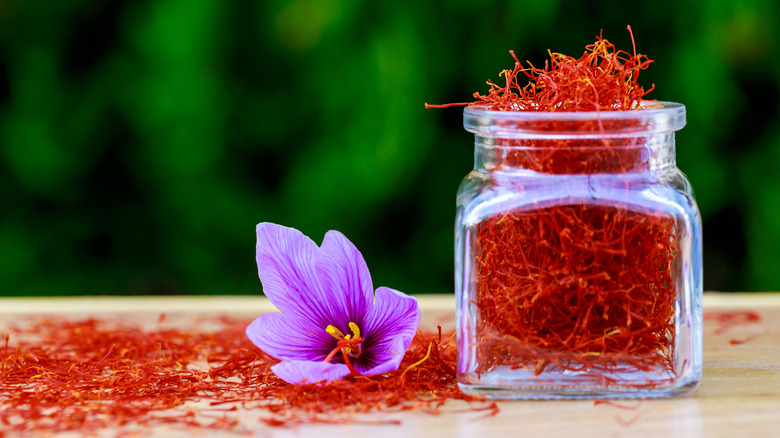 saffron in jar with saffron flower