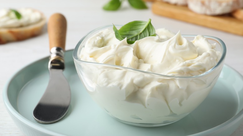 bowl of cream cheese with knife