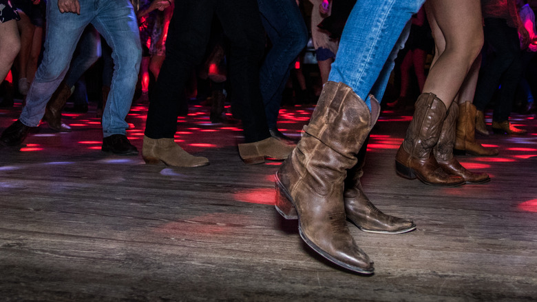 People dancing in cowboy boots