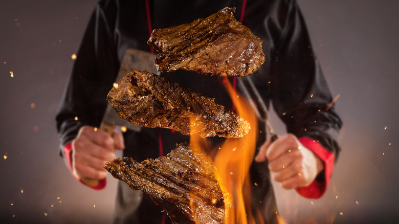 Chef cooking steaks