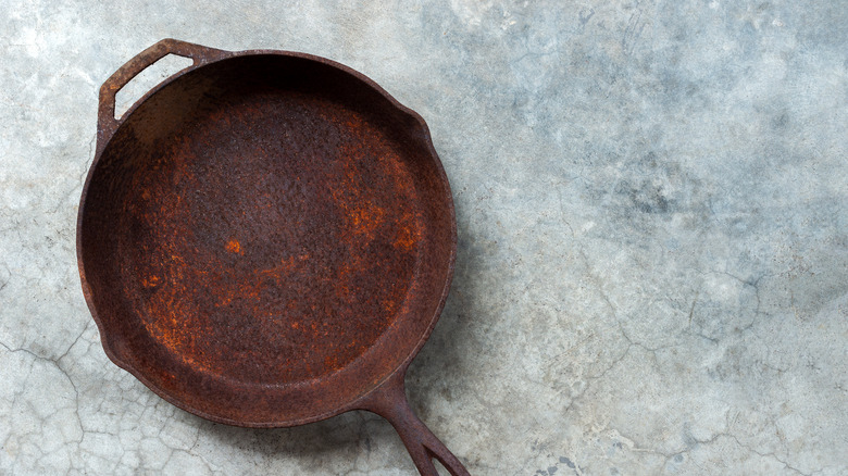 Heavily rusted cast iron pan