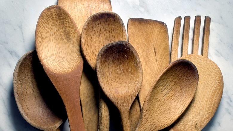 wooden utensils on blue background