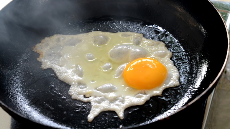 egg frying in hot pan