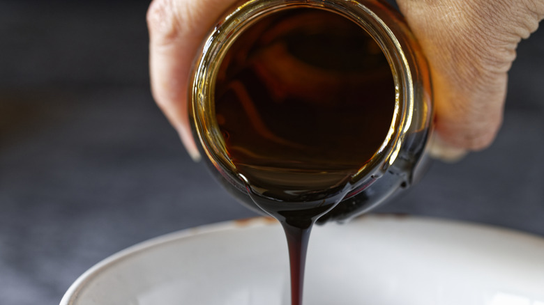 pouring molasses into a bowl