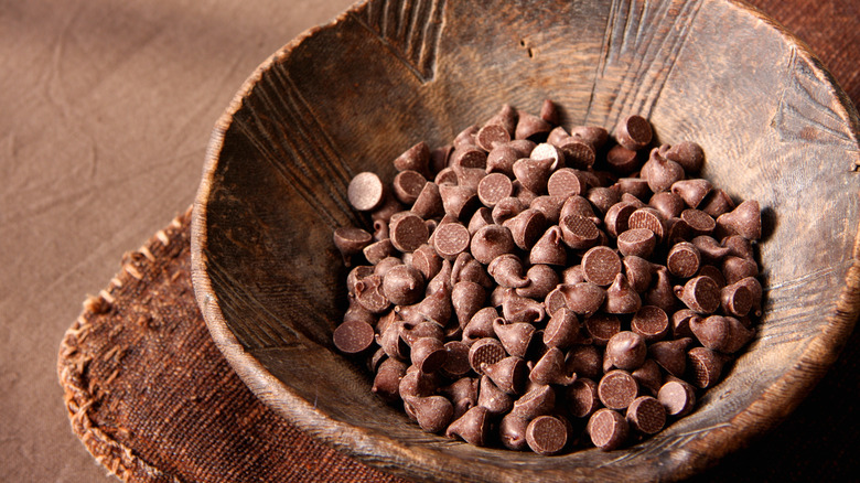 Chocolate chips in wooden bowl