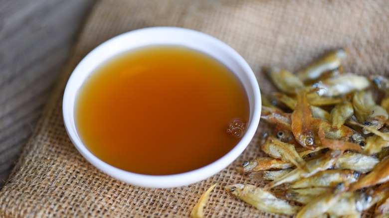 dried fish and bowl of fish sauce