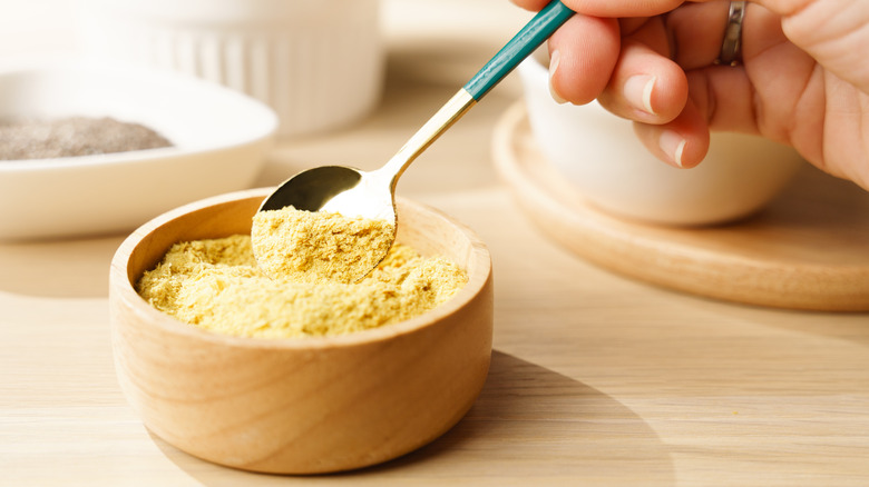 bowl and spoon of nutritional yeast