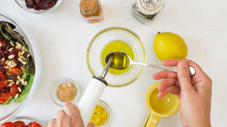 person making vinaigrette with ingredients