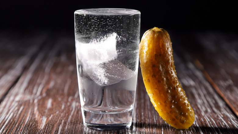 pickle and glass of ice