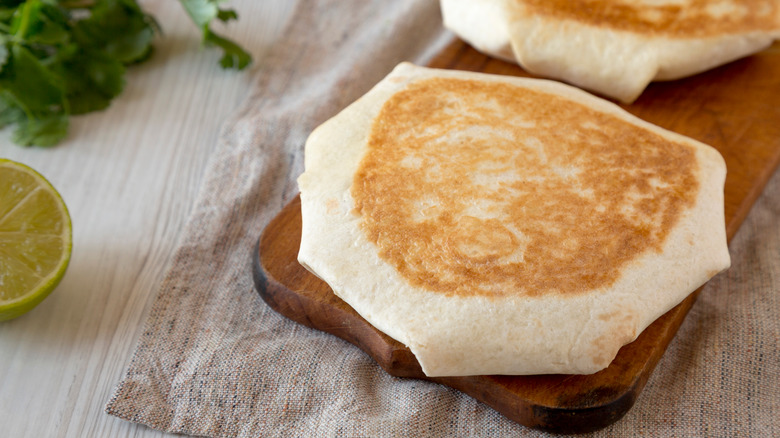 crunchwrap on wooden board