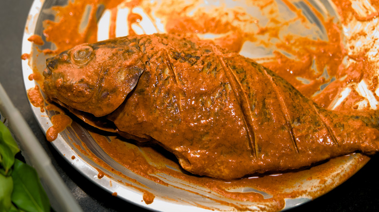 whole fish coated in orange marinade