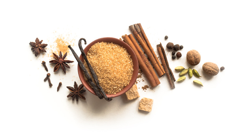 Assorted spices on white surface