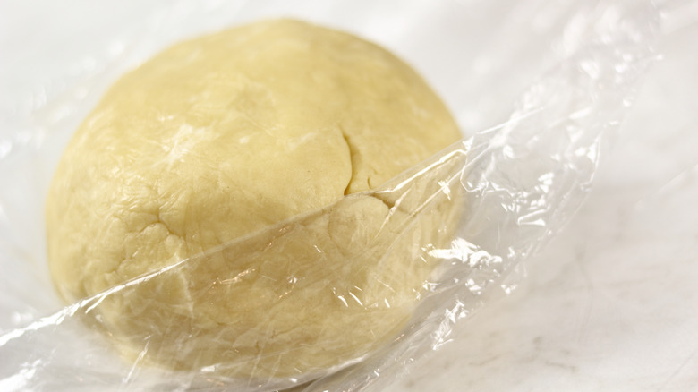 Chilled dough in cling film 