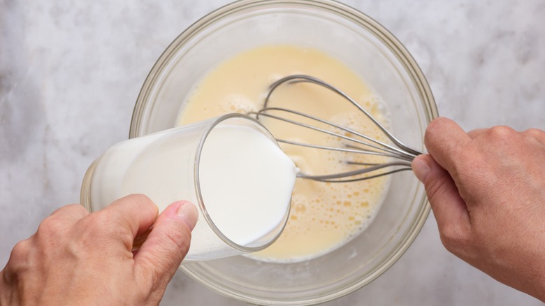 Milk and eggs in bowl