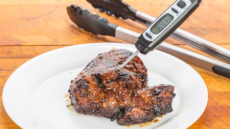 meat thermometer in steak