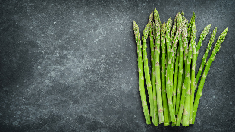 asparagus on black concrete background