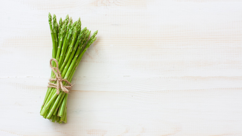 asparagus on wooden board