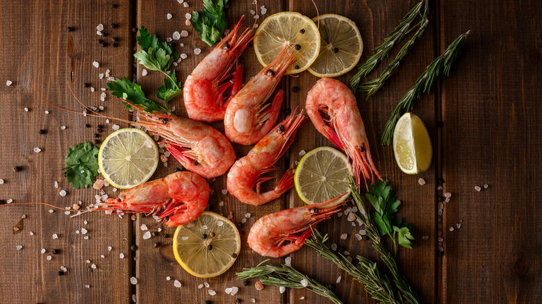 Shrimp on table with herbs