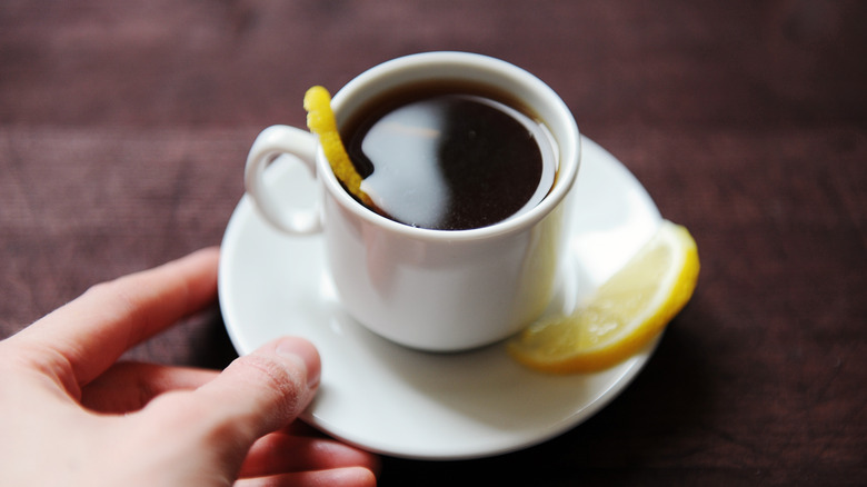 Cappuccino with lemon peel garnish