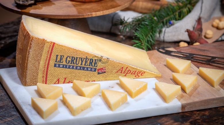 gruyère cheese wedges on board