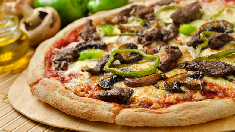Pizza with bison steak and peppers