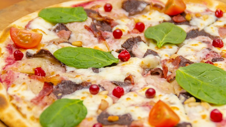 Pizza with venison and cranberies 