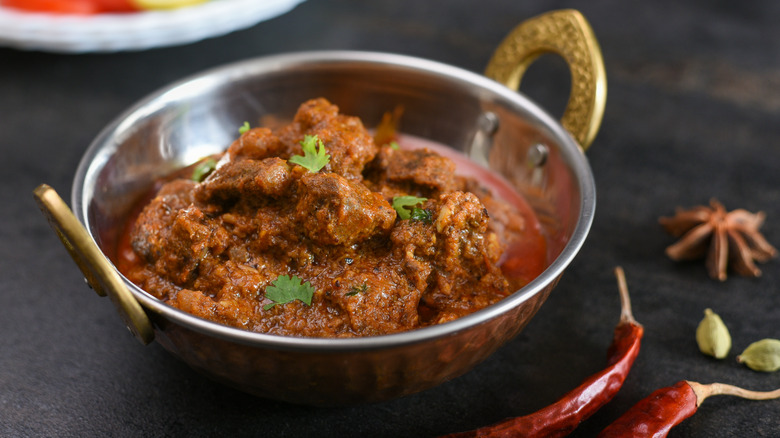 Silver pot of beef curry