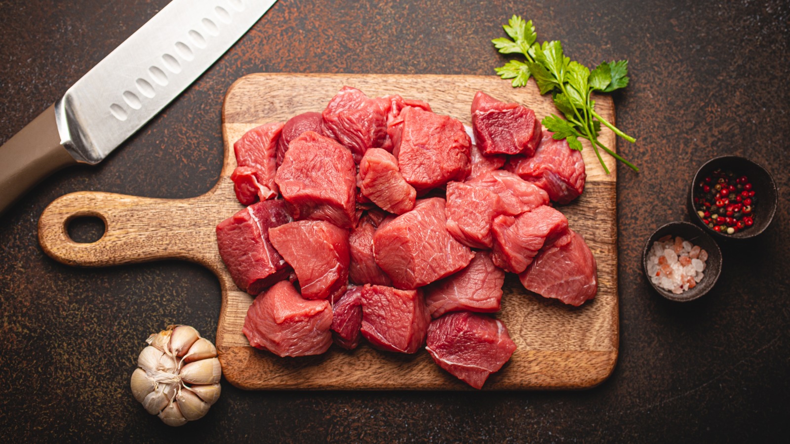 Stewed Meat In Cooking Pot With Ingredients And Kitchen Tools On Dark  Background High-Res Stock Photo - Getty Images