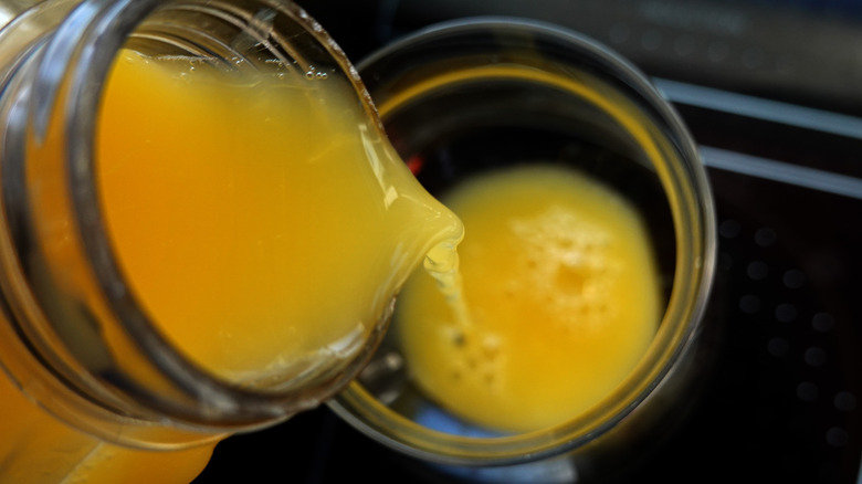 orange juice poured into glass