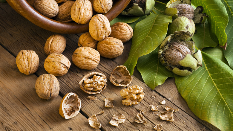 walnuts spilling from wooden bowl