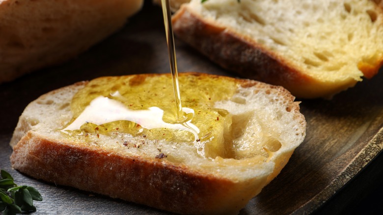 Olive oil poured onto bread