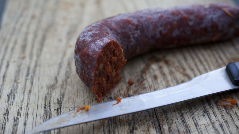 chorizo sausage with knife