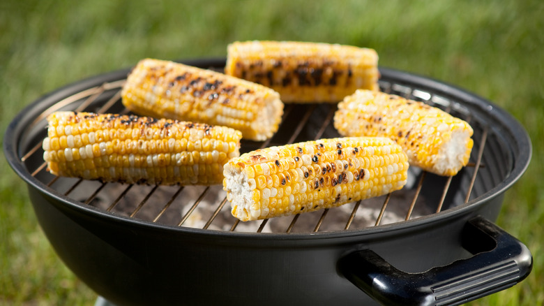 corn cooking on a grill