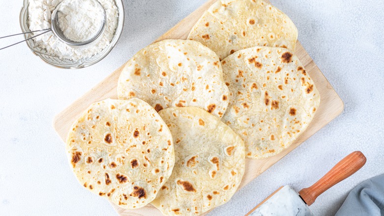 homemade tortillas on wooden board