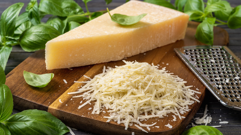 shredded cheese on cutting board