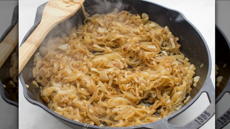 Onions caramelizing in a skillet