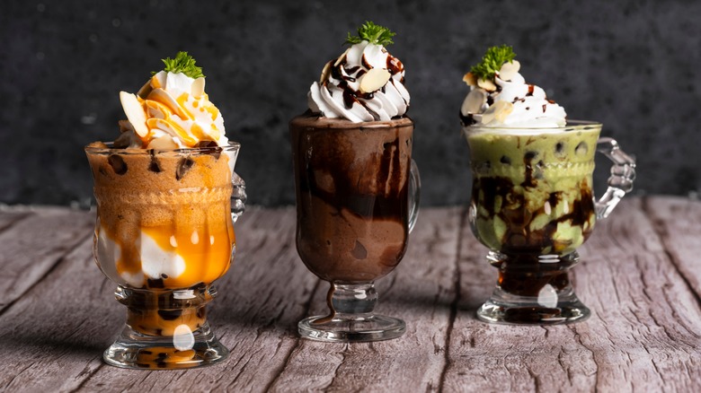 three gourmet ice cream sundaes