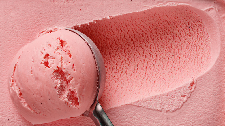 strawberry ice cream being scooped